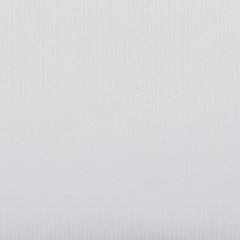 Vertical white pleated blind filling the frame with subtle ribbed texture; closed and diffusing soft daylight; minimal interior context, evenly lit neutral background.