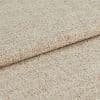 Beige woven upholstery fabric, densely textured and folded once; showing looped weave and subtle two-tone yarns, close-up on a neutral background under soft, even lighting.