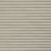 Beige horizontal slatted roller blind, fully lowered with wood-grain texture and narrow ridged slats; closed and blocking light, filling the frame against neutral indoor lighting.