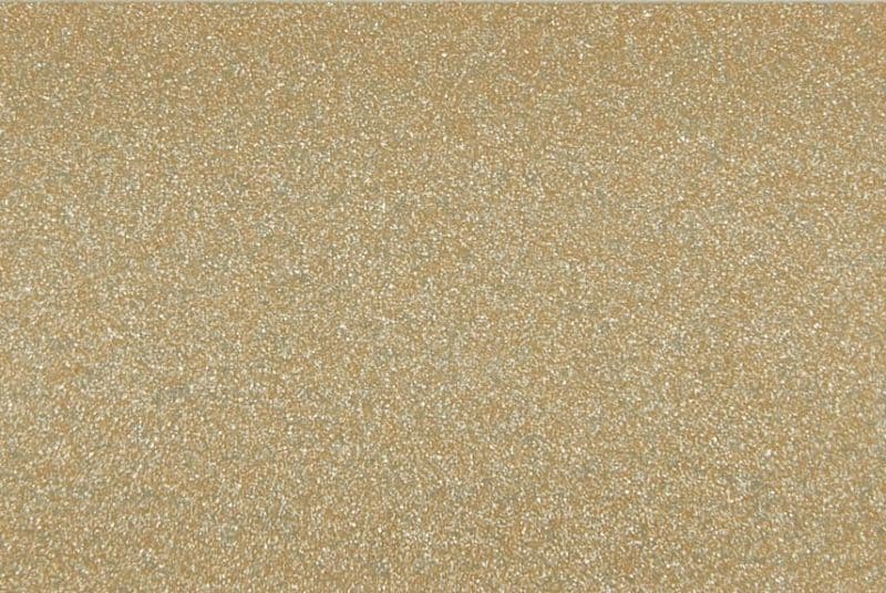 Fine golden-brown granular material with small reflective particles — forming a uniformly textured, glittering surface in a close-up, evenly lit view that fills the frame.
