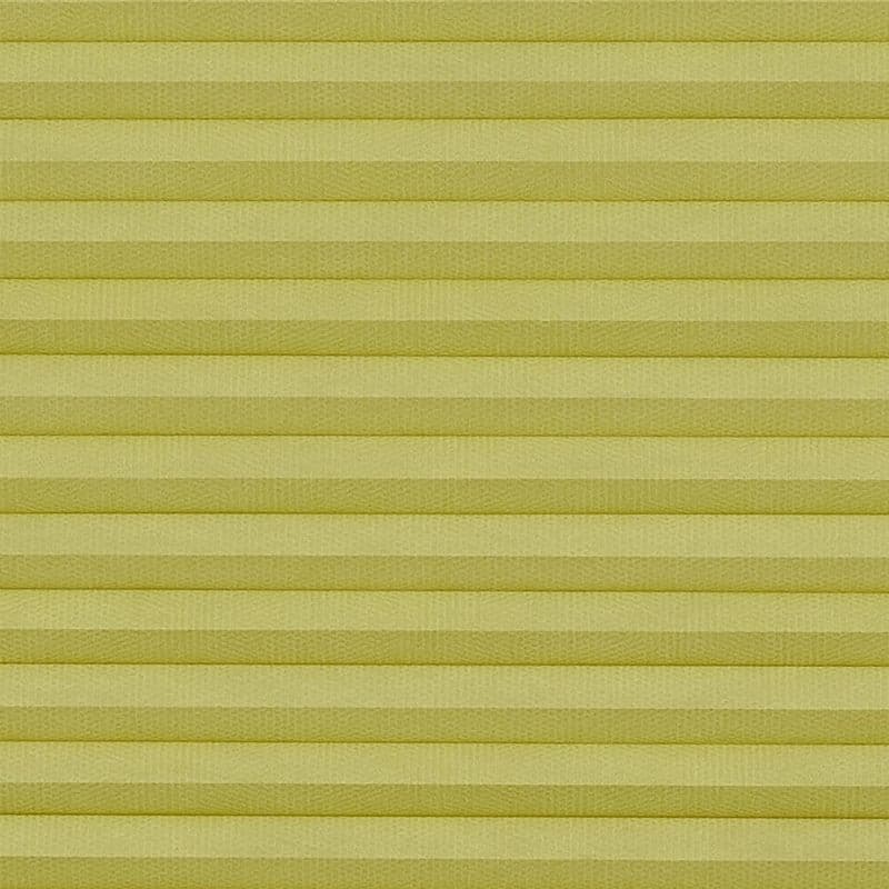 Pale yellow cellular (honeycomb) pleated blind, mounted and fully closed with evenly spaced horizontal cells; filtering and diffusing light, covering a window in an interior with soft, even lighting.