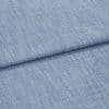 Blue woven upholstery fabric folded across the frame, showing a horizontal overlap and nubby textured weave; close-up shot with soft, even studio lighting and no background details.