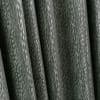 Heavy dark green patterned curtains with vertical folds and subtle silver streaks, closed and hanging in tight pleats, indoors under soft light, close-up with no visible view.