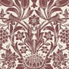 Stylized floral medallion repeats across a textured cream background; maroon curling leaves, tulip-like buds, grape clusters and rosettes form a vintage damask wallpaper pattern.