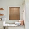 Wooden horizontal slatted blinds in the window, closed and filtering warm daylight; cozy kitchen nook with cushioned bench, neutral cabinetry, shelves and a wall sconce.
BREAD
