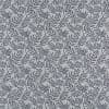 Light gray wallpaper patterned with dense navy fern-like branches; the print repeats uniformly across the surface, forming a subtle botanical motif under soft, even indoor lighting.