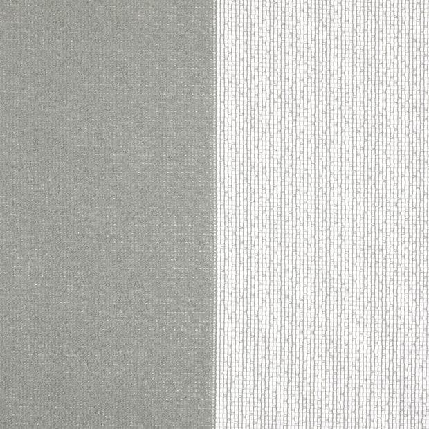 A pair of vertical curtains — left opaque gray textured panel, right white sheer with small rectangular mesh pattern — hanging closed, softly filtering daylight in a neutral interior.