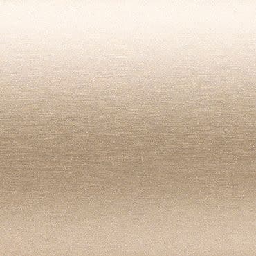 Beige brushed-metal surface with subtle horizontal grain — displaying a gentle light-to-dark gradient — evenly lit, flat background resembling satin fabric or a metallic panel.
