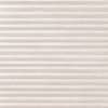 Beige pleated cellular blind, horizontal accordion folds with linen texture, fully lowered and closed, softly diffusing daylight across a neutral interior wall.