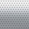 Perforated aluminum panel with evenly spaced round holes in a regular grid; serving as a vent or acoustic grille; shown under soft, diffuse lighting producing a subtle top-to-bottom gradient.