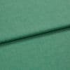 Green woven fabric folded over itself, forming a horizontal overlap; close-up studio view with even lighting and a subtle heathered texture.