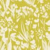 White floral silhouettes scatter and overlap, suggesting blossoms and leaves, painted with brushlike strokes against a textured chartreuse background, creating an abstract textile pattern.