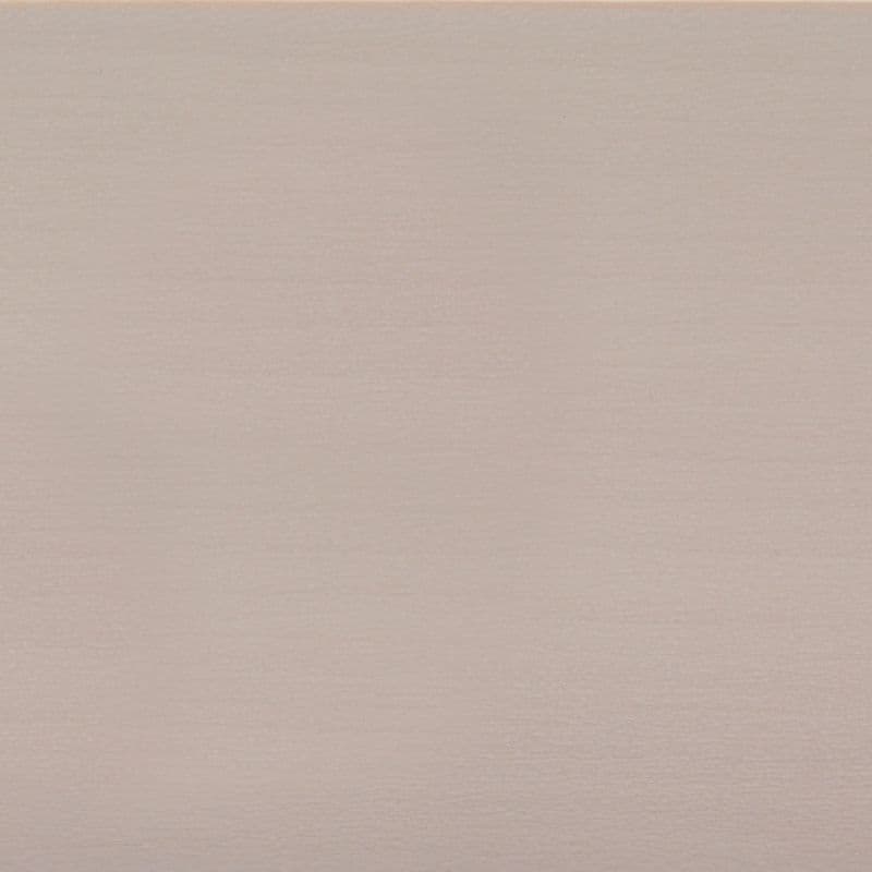 Pale blush-beige textured wallpaper filling the frame, subtly ribbed horizontal grain; evenly lit, neutral-toned surface suggesting an interior wall or backdrop under soft, diffuse lighting.