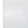 White pleated cellular window blind with visible left edge and horizontal folds, closed and diffusing daylight; close-up view against a bright, neutral background.