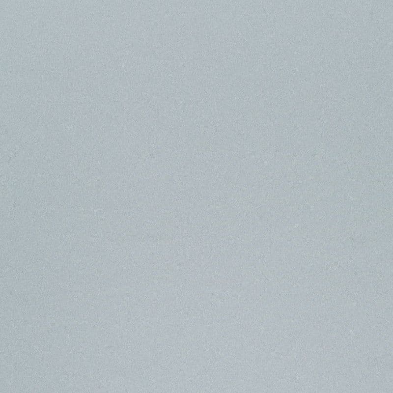 Light blue-gray textured fabric or wallpaper — covering the entire frame, stationary — evenly lit, neutral interior surface with a subtle speckled pattern.