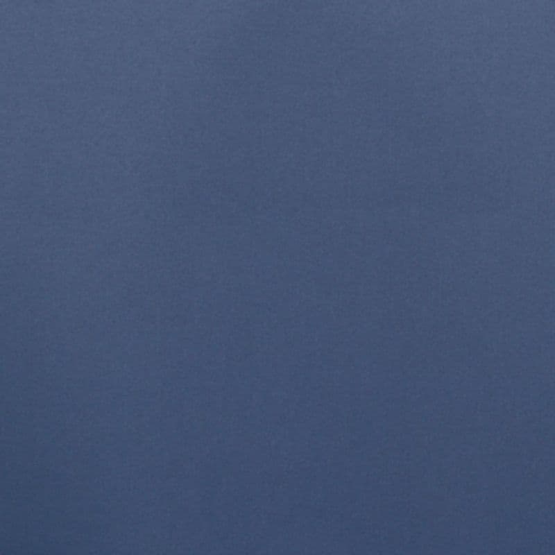 Matte navy-blue textured surface occupying the frame; appearing flat and motionless. Close-up view with even, diffuse lighting, suggesting an interior wall or fabric.