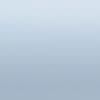 Pale blue-gray gradient surface; uniformly lit and featureless; appears as a smooth wall or sky under soft diffuse lighting with no discernible objects or depth cues.