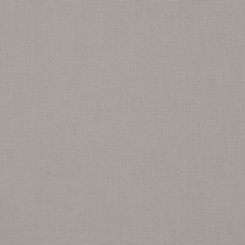 Linen-textured beige fabric panel fills the frame, lying flat and unwrinkled; soft, even lighting reveals a subtle woven pattern across the surface.