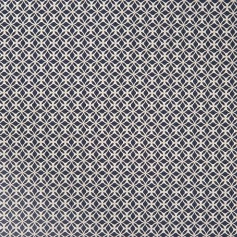 White interlocking circular-lattice pattern on navy fabric; repeating tessellated motif covering the entire surface; appears as flat wallpaper or upholstery in even, diffuse interior lighting.