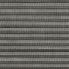 Grey pleated cellular blind, fully closed, narrow horizontal folds with perforated textured fabric; filtering light and covering a window in a softly lit interior, no visible view.