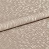 Beige jacquard fabric with glossy, raised crescent pattern; folded once across the frame, overlapping edges; close-up studio view with soft, diffuse lighting emphasizing the textured sheen.