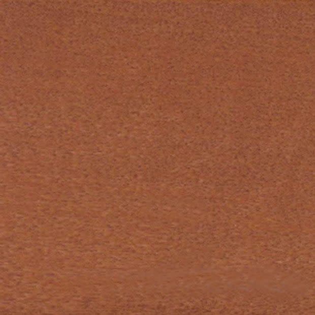 Coarse brown textured fabric occupying the entire frame; lying flat and uniform, appearing like carpet or upholstery under soft warm lighting with no other visible objects or features.
