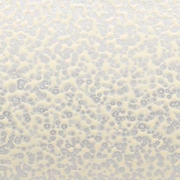 Frosted pebble-textured glass pane fills the frame, raised circular patterns obscuring detail; diffusing and softening bright backlight; neutral beige-gray tones, no visible surroundings.