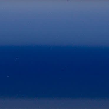 Smooth glossy blue panel centered, showing horizontal gradient bands; reflecting faint scratches and diffuse highlights; fills the frame, suggesting a close-up of painted metal or plastic under soft lighting.