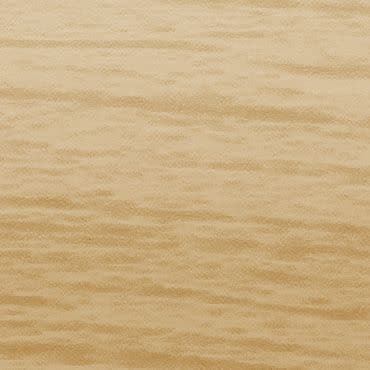 Light-colored wooden panel with subtle horizontal grain; smooth, matte surface occupying the frame; photographed close-up under even, warm studio lighting, no other objects or visible context.
