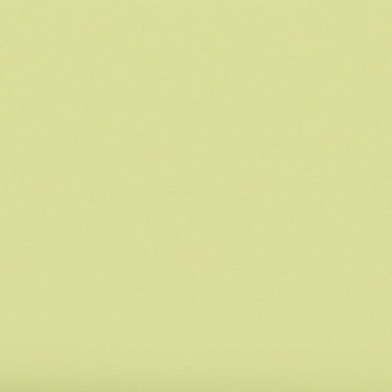 pale yellow, slightly textured sheet fills the frame; surface uniform and static, showing faint paper grain and soft edge shadows; neutral, evenly lit background with no discernible objects or features.