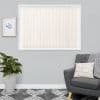 Beige vertical blinds fill a centered rectangular window—evenly spaced fabric slats with bottom chains—closed and softly filtering daylight; grey living room with framed botanical print, potted plant, armchair, patterned rug.