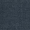 Dark charcoal, pebble-grain textured fabric fills the frame, lying flat with subtle wrinkles and grain; evenly lit close-up showing only the fabric’s surface, no other objects or context.