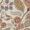 A paisley floral design spreads across a textured cream background: stylized multicolored leaves, blossoms, and curling vines in teal, pink, gold, and mauve, forming a repeating decorative pattern.