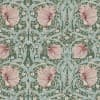 Wallpaper with large ruffled pink flowers, pale blue-green twisting leaves and tiny white blossoms — forming a symmetrical repeating pattern — on a muted green background suggesting vintage Arts-and-Crafts decor.