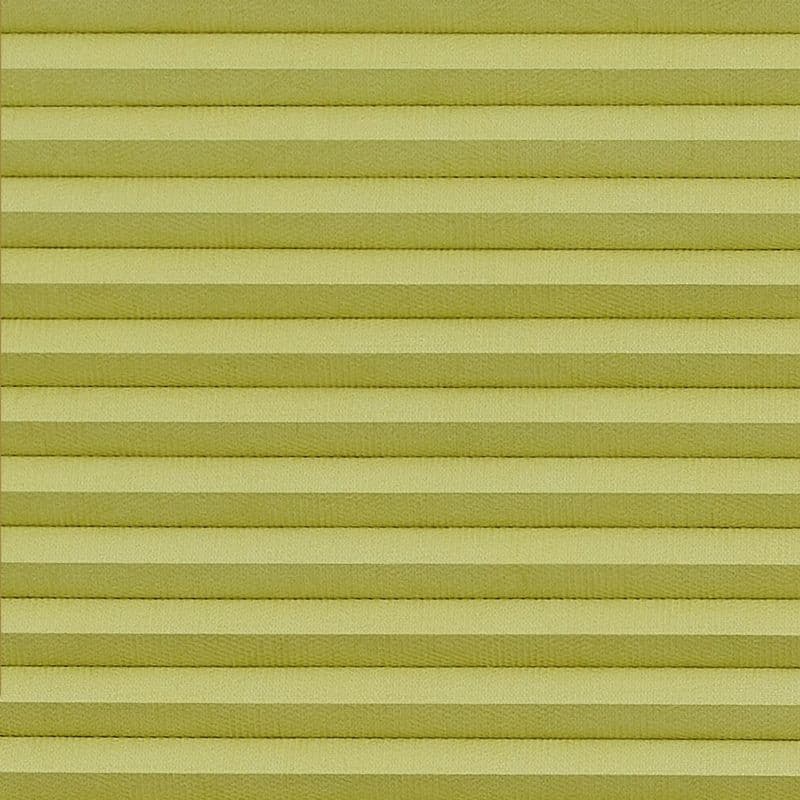 Horizontal pleated blinds (pale yellow‑green), fully lowered and closed with evenly spaced folds, filtering diffuse indoor light and filling the window area; no view visible.