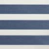 Zebra roller blind with wide navy-blue textured and white sheer horizontal bands, alternating to filter light, mounted indoors under soft ambient lighting with no visible outside view.