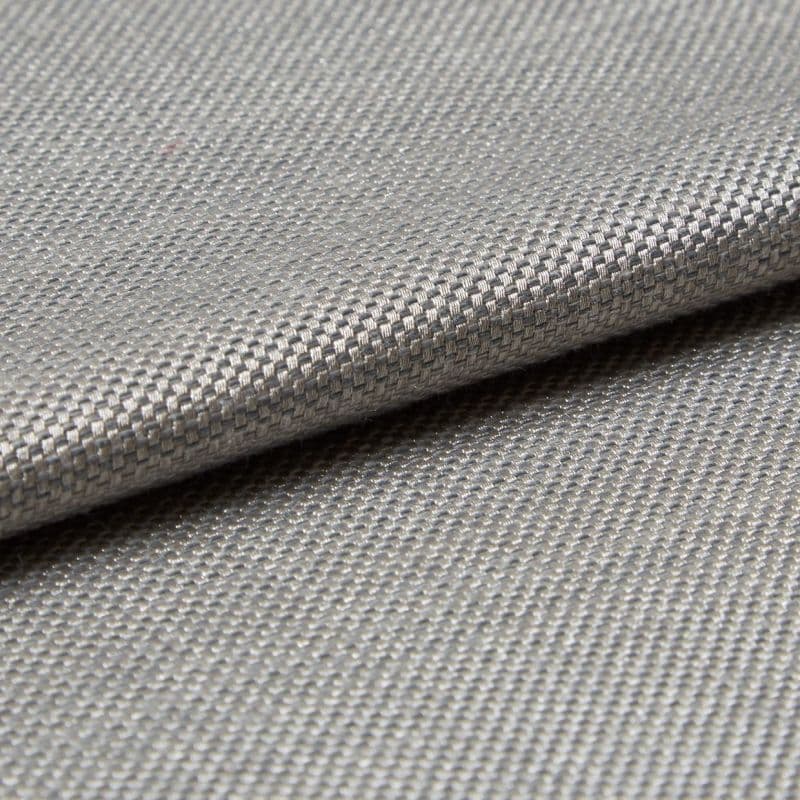 Close-up of woven silver‑grey fabric (tight basket weave) folded over itself; the fold creates a horizontal overlap, lit evenly to emphasize fine texture and subtle metallic sheen in a neutral setting.