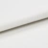 White canvas-like fabric folded diagonally, displaying a fine woven texture and overlapping edge; close-up studio view with soft, even lighting and neutral background emphasizing the weave detail.