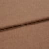 Brown woven fabric, folded once creating a horizontal overlap, showing fine heathered texture and tight weave; lying flat on a neutral surface under soft, even studio lighting, close-up view.