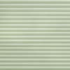 Light green pleated cellular shades spanning the frame, fully lowered and closed with horizontal ribbed texture, softly filtering diffuse daylight into a neutral, softly lit interior.