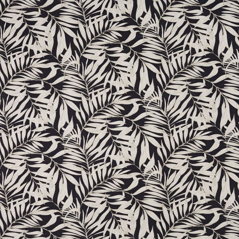 Cream palm-leaf patterned wallpaper covering a wall, leaves repeating in diagonal fronds; high-contrast cream-on-black design providing a decorative, flat surface suitable for an interior accent wall.