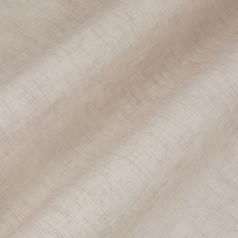 Beige, semi-sheer crosshatched curtain fabric draped in soft horizontal waves, gently filtering light; close-up view emphasizing woven texture and subtle, warm indoor lighting.