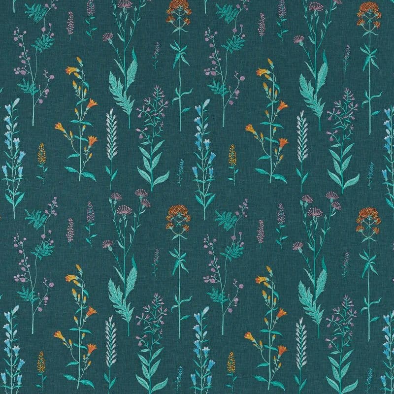 Teal fabric patterned with slender wildflower stems in turquoise, orange, and lavender, arranged in vertical repeats, creating a delicate botanical motif on a textured dark teal/blue-green textile background.