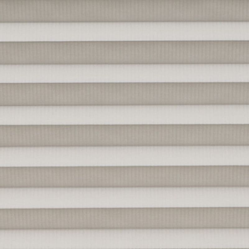 Horizontal pleated cellular shades fully lowered across the window, their alternating light-and-dark bands filtering soft daylight, filling a neutral-toned interior with diffused, even illumination.