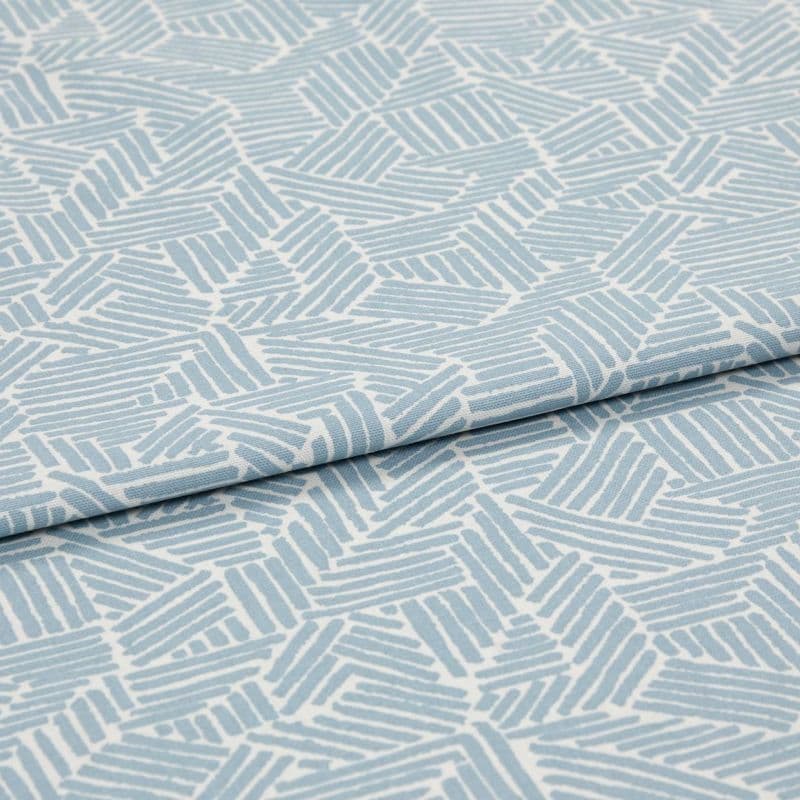 Light blue-and-white patterned fabric with geometric short parallel-stripe blocks; folded with an overlapping edge; close-up on textile surface under soft, even studio lighting.
