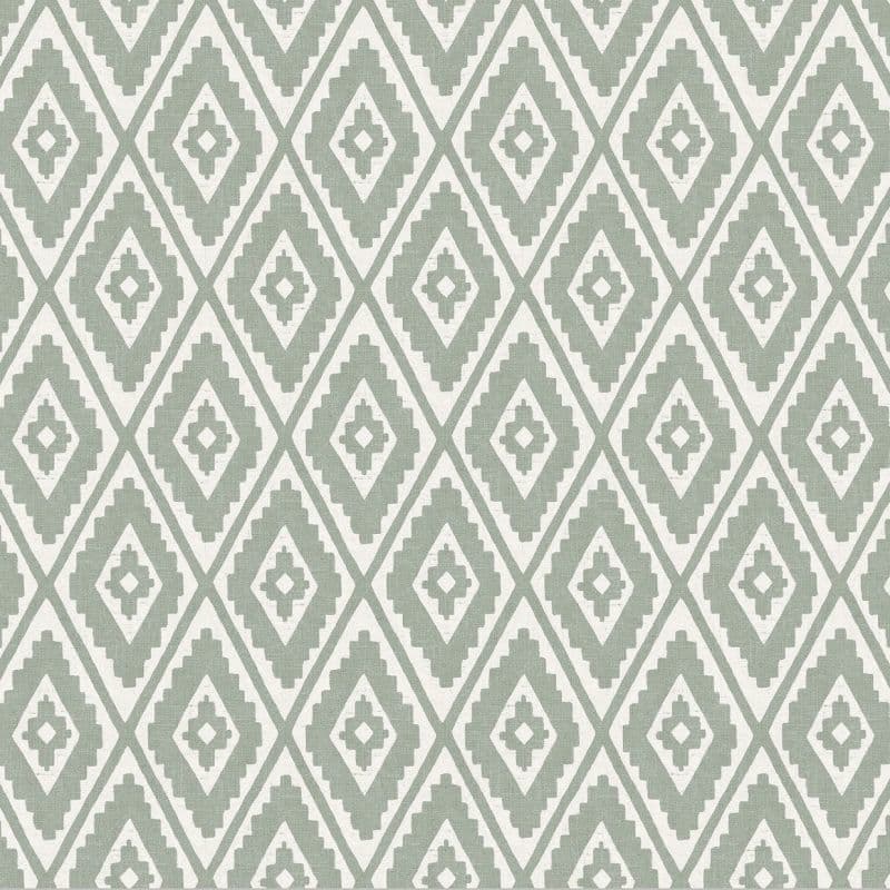 Woven textile or wallpaper with pale green and white stepped-diamond (ikat) pattern — repeating across the surface — used as decorative wallcovering or upholstery in a neutral, evenly lit interior.