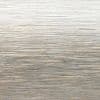 Brushed metal surface with fine horizontal striations, reflecting soft, cool light; serving as a neutral, textured backdrop in an evenly lit, unobtrusive setting.