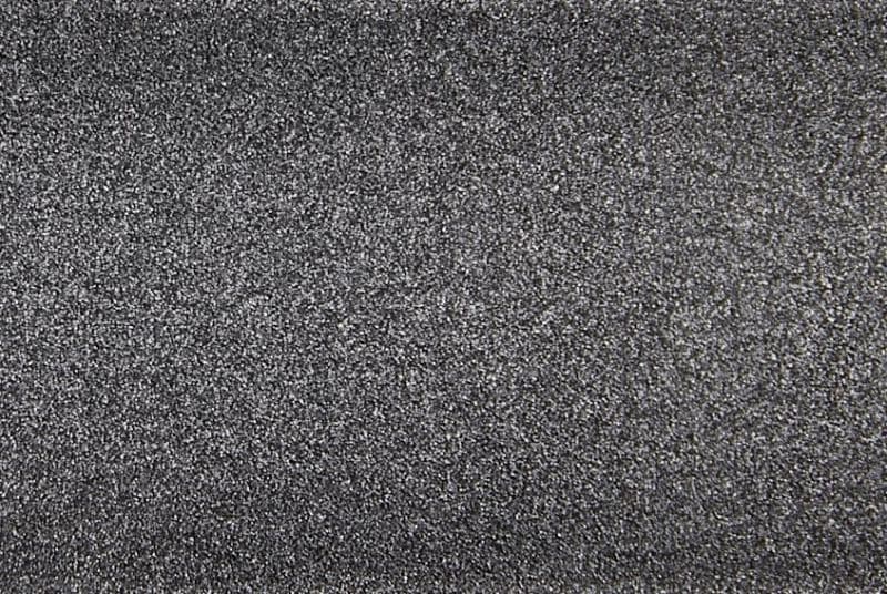 Fine-grained dark gray textured surface, densely speckled and rough, filling the entire frame; close-up macro view with even diffuse lighting and no discernible surroundings.