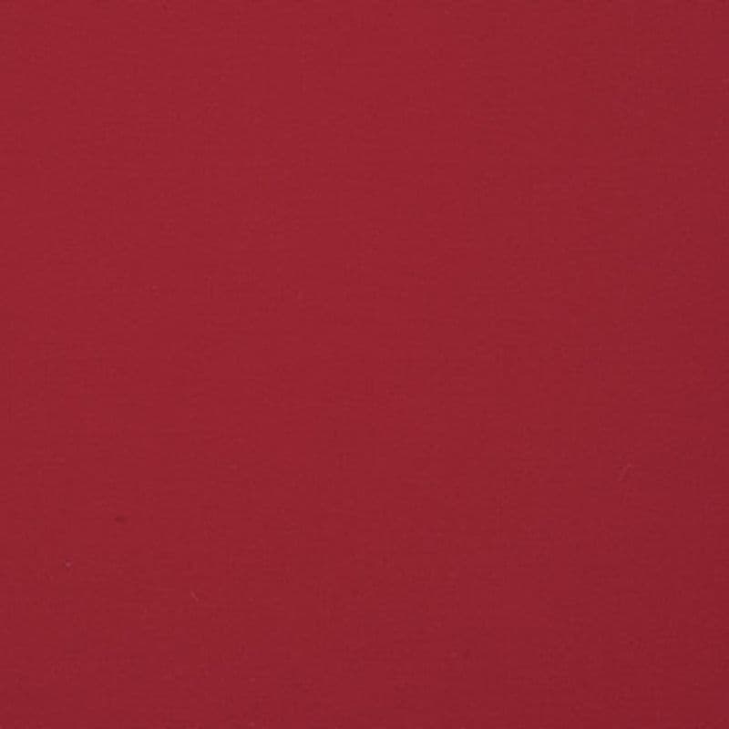 Solid burgundy fabric, stretched flat across the frame, fills the view with uniform lighting and a subtle woven texture showing tiny fibers.