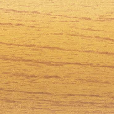 Close-up of a golden-toned horizontal wood-grain surface, displaying subtle darker striations; static, evenly lit and tightly framed with no other objects or visible depth cues.
